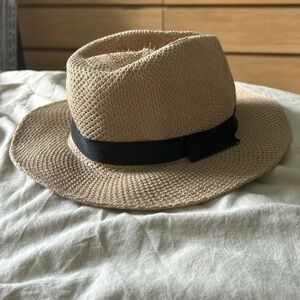 Straw sun hat with a black bow